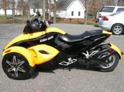 This is a 2008 CAN-AM SPYDER RS SM5 Trike. It is bright yellow. 
